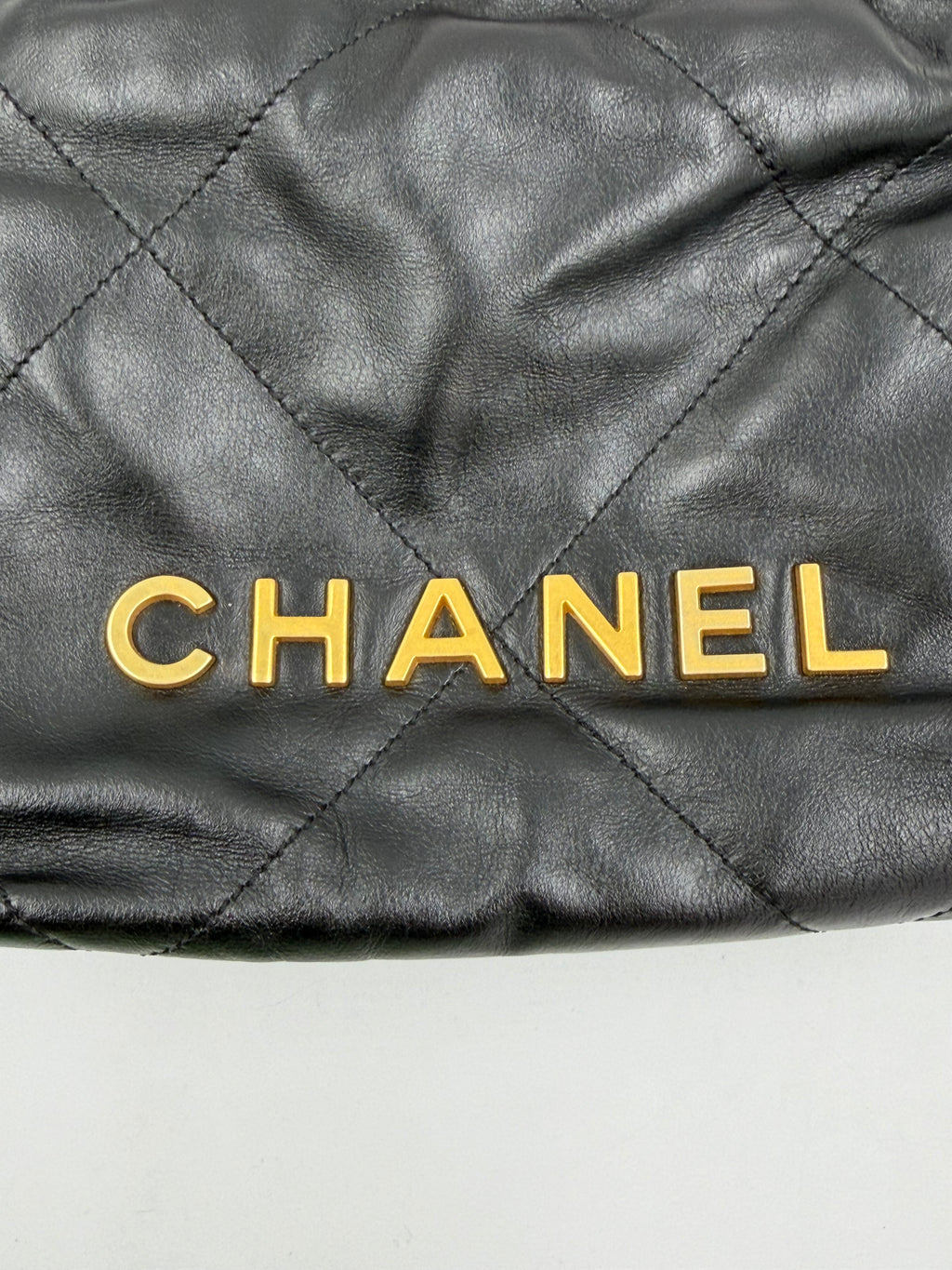 Pre-owned Chanel Shiny Calfskin Quilted Mini Chanel 22 Black Gold Hardware - Authenticated