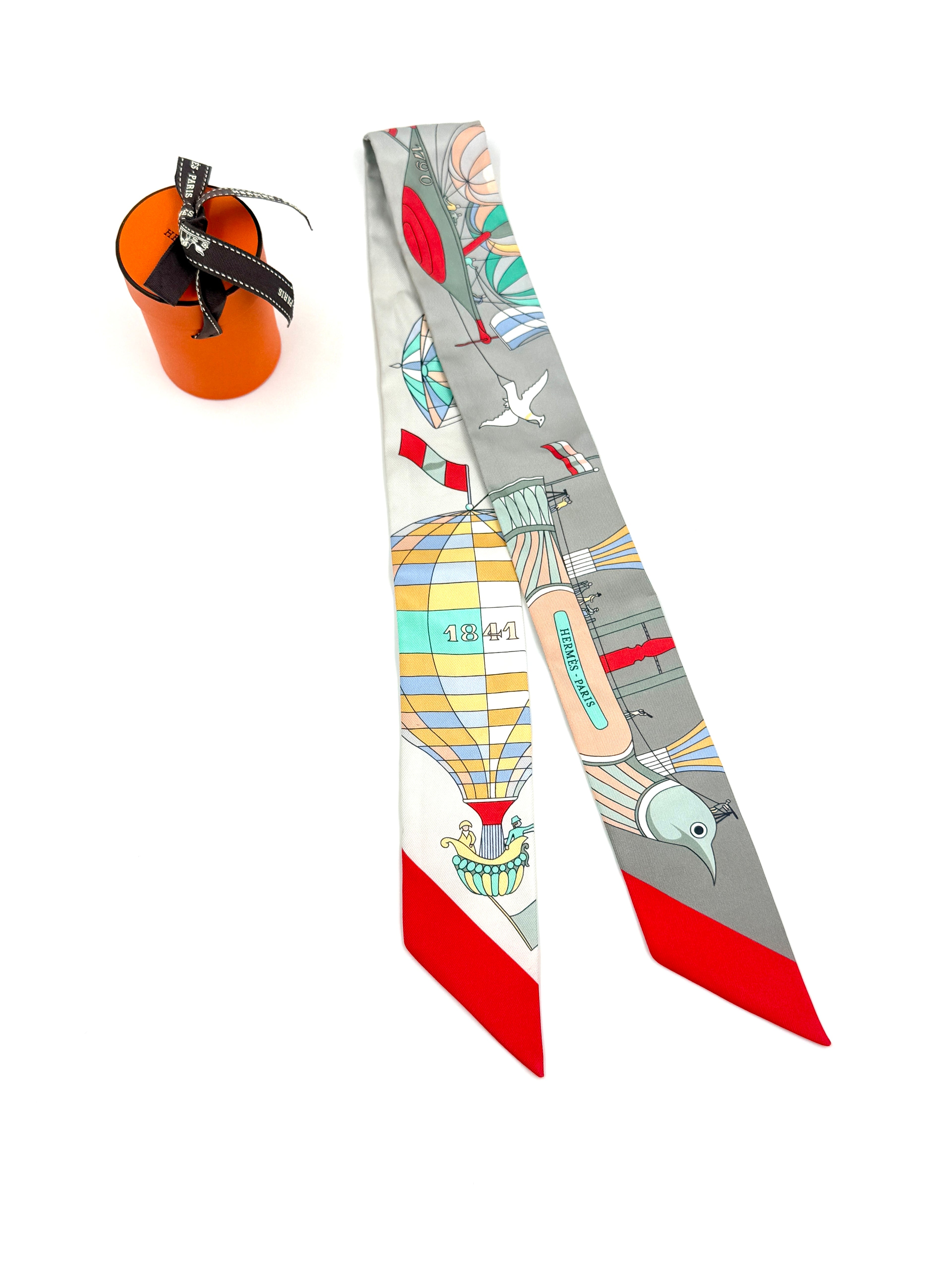 Pre-Owned Hermès "Les Folies du Ciel" Silk Twilly Scarf - Authenticated