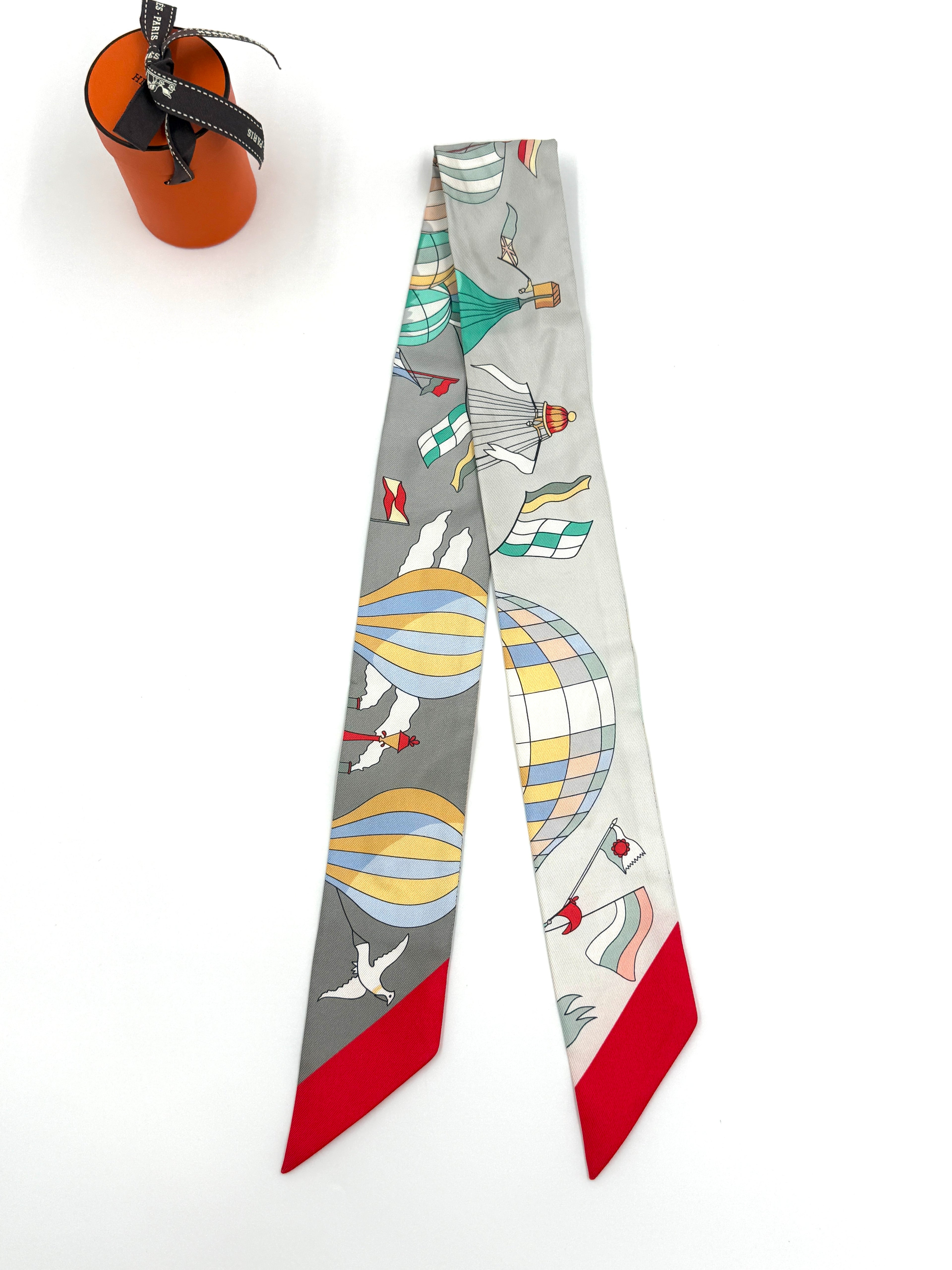 Pre-Owned Hermès "Les Folies du Ciel" Silk Twilly Scarf - Authenticated